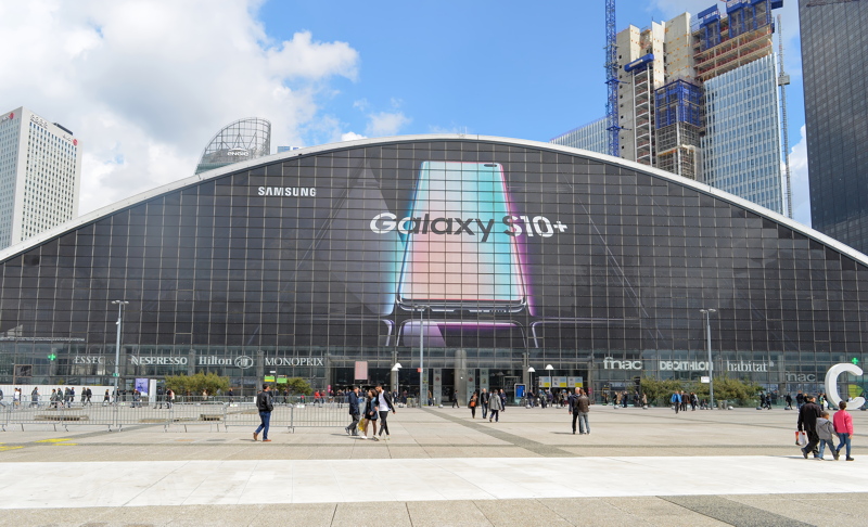 3 - Center for New Industries and Technologies building in La Défense business district near Paris, France, featuring a large promotional banner for the Samsung Galaxy S10+